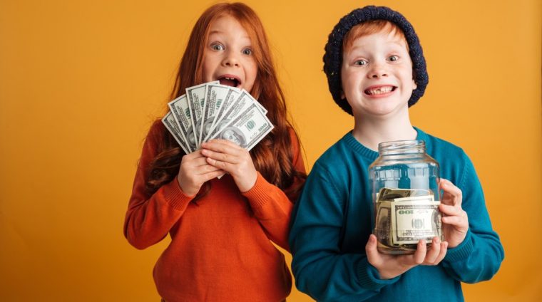 excited-little-redhead-children-holding-money